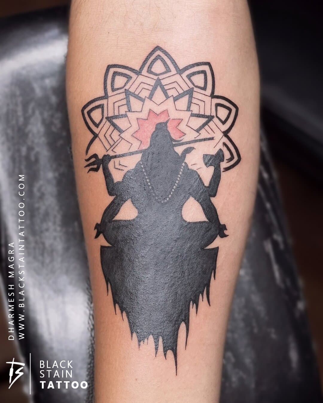 Lord Shiva mandala tattoo with color accents - spiritual religious design Ahmedabad