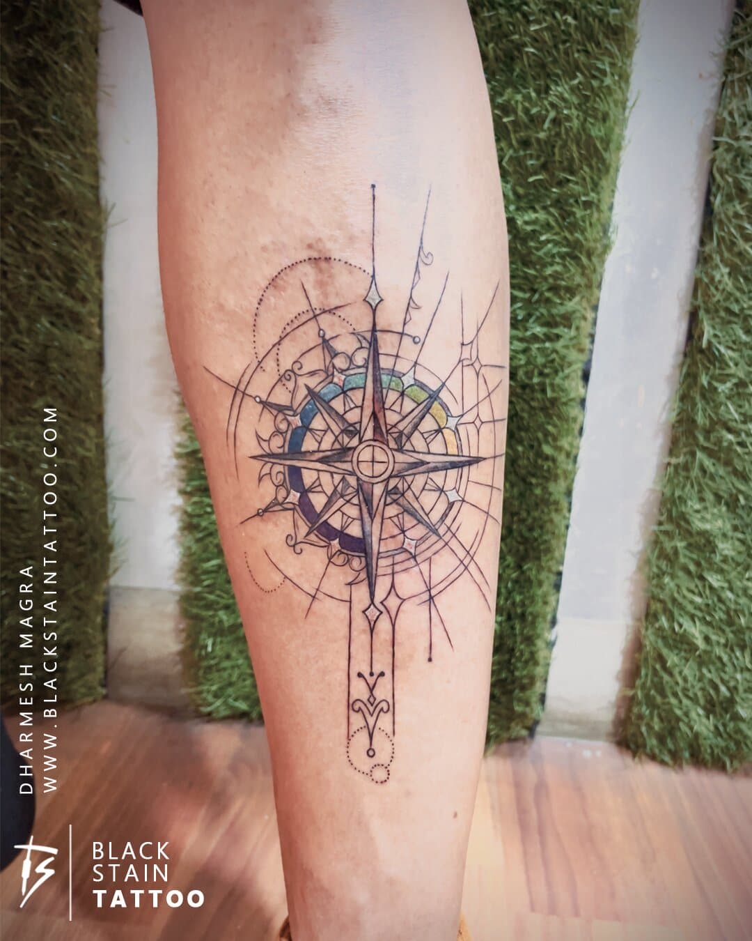 Geometric compass rose tattoo with colorful elements - direction symbol Ahmedabad