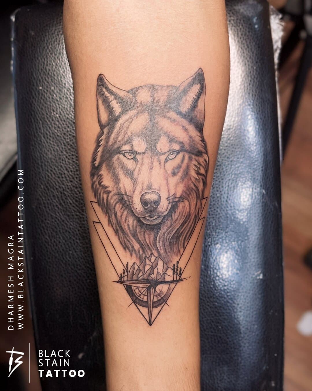 Realistic wolf head portrait tattoo with geometric elements - professional artist Ahmedabad